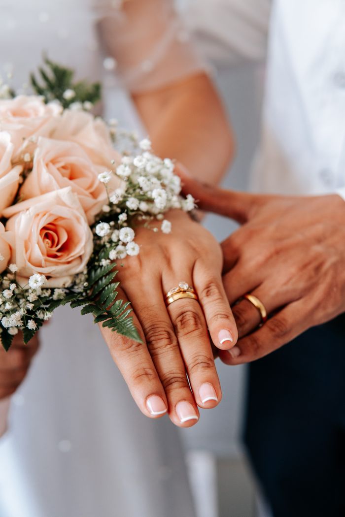 creative-01 A lovely arrangement of wedding rings with a delicate bouquet represents love and togetherness.